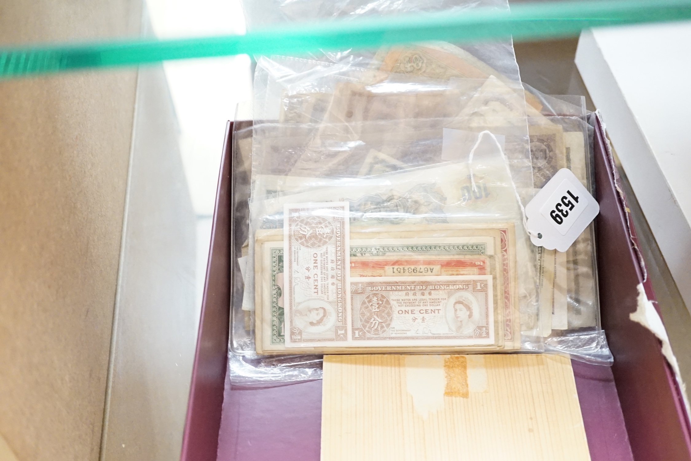 A group of Chinese tong bao cash coins, mostly Qianlong and Jiaqing and various World Bank notes including central bank of China 50 customs gold units and 20 customs gold unit